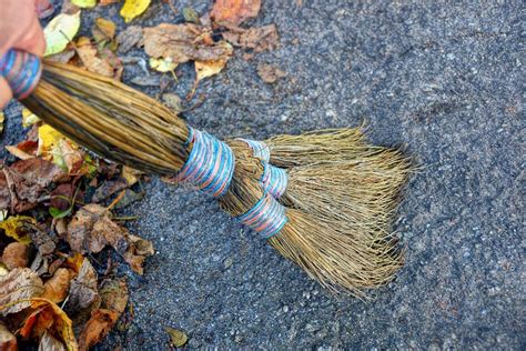 Sweeping Dry Leaves With Broom Stock Image Image Of Maintenance Dirt