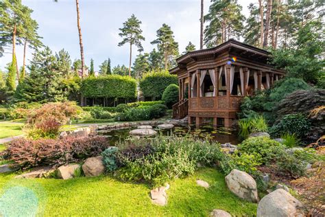 Brown Wooden Gazebo Surrounded By Green Trees · Free Stock Photo