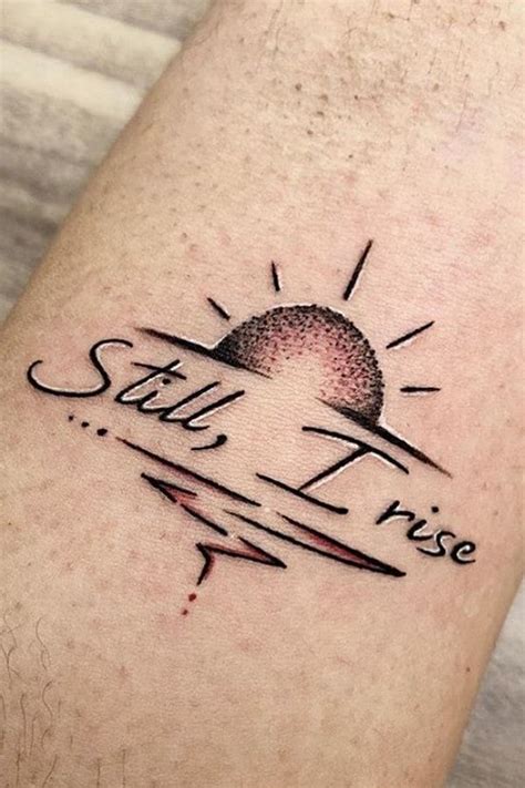 A Small Tattoo On The Leg That Says Still I Rise With An Arrow And Sun