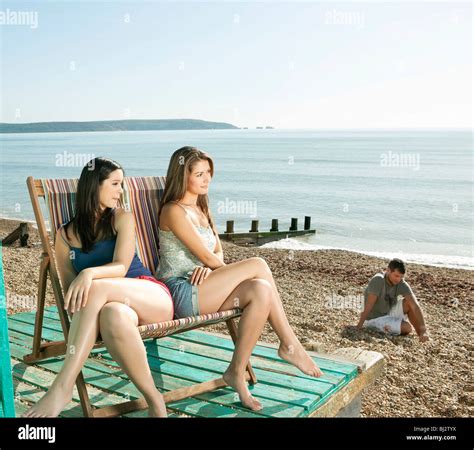 Friends Relaxing At The Beach Stock Photo Alamy