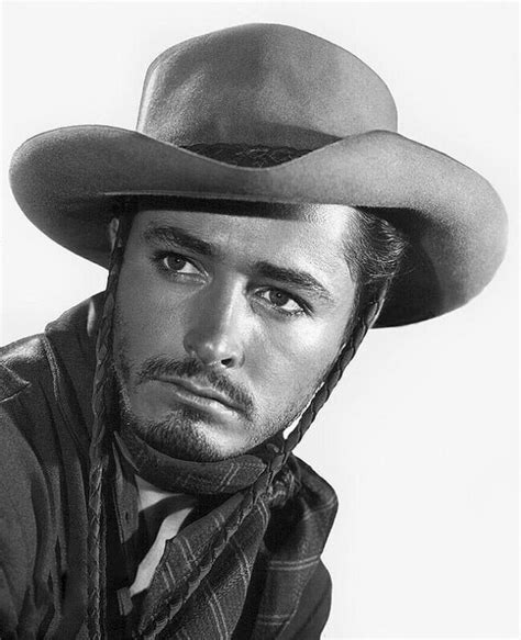 A Black And White Photo Of A Man Wearing A Cowboy Hat With The Name