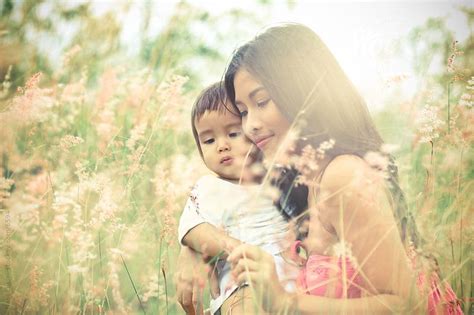 Portrait Of Beautiful Mother And Child In The Nature By Nabi Tang