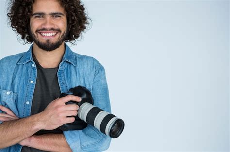 Premium Photo Happy Male Photographer Standing In Studio