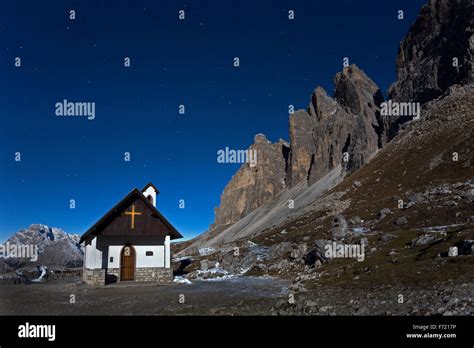 Tre Cime Di Lavaredo Peaks And Chapel On The Three Peaks Trail On Night