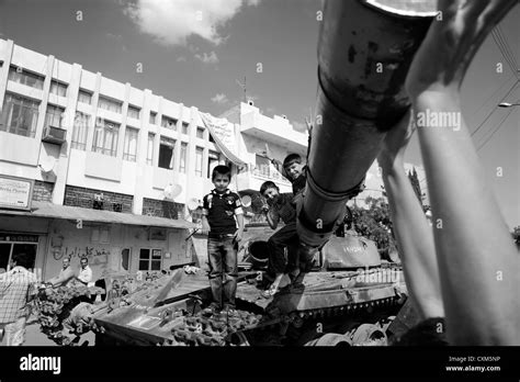 Young Boys Plat On A Destroyed T80 Tank In Azaz Stock Photo Alamy