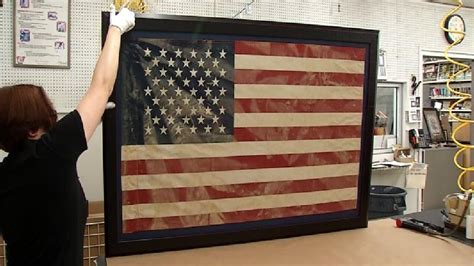 Maybe you would like to learn more about one of these? Tattered, mud-covered American flag framed for flood ...
