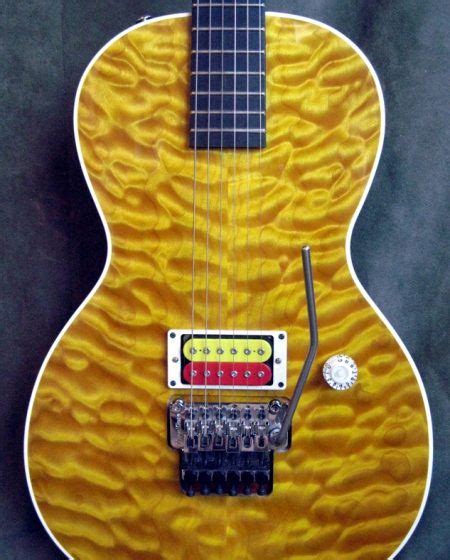 An Electric Guitar With A Yellow Flame Finish