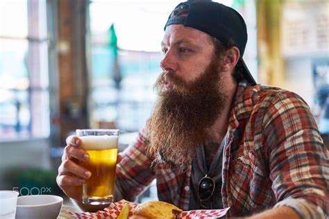 Bearded Hipster Drinking A Craft Beer At Restaurant Or Pub By Joshua Resnick On 500px Hipster
