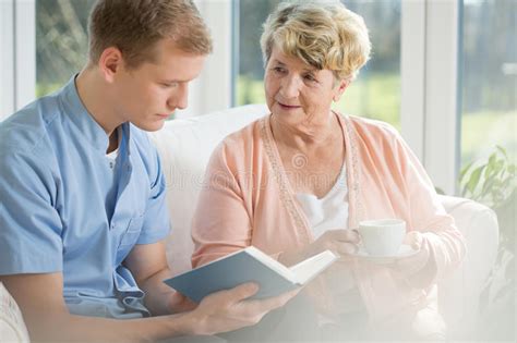 Older Woman Spending Time With Young Man Stock Image