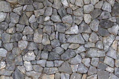 Surface Of Natural Stone Walls Background And Textures Stock Photo