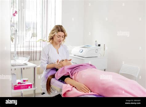 Spa Resort Beauty And Health Concept Beautiful Woman In Spa Salon Getting Face Treatment