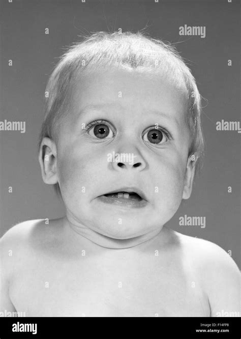 1960s Blonde Baby Making Funny Facial Expression Fear Scared Shock Awe