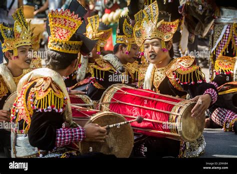 Young Indonesian Guys And Balinese Musicians Practicing At The Start Of