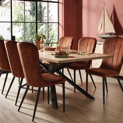 The sturdy metal base has a brushed nickel finish. Mason Rust Velvet Dining Chair