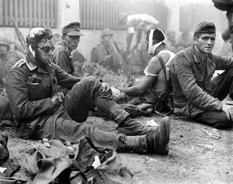 Bandw Wounded German Soldiers Taken As Pows By American Troops During
