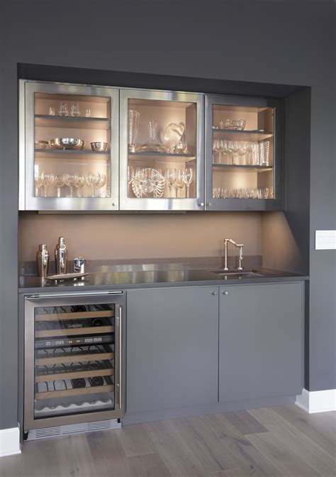 This Modern Wet Bar Features Upper Stainless Steel Cabinets And A Wine