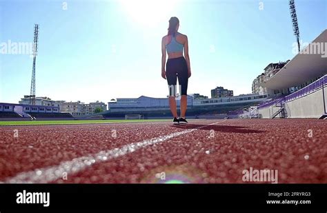 Track Runner Athlete Woman Warming Up Before Running At A Stadium Slow