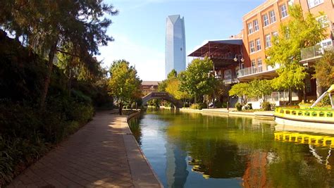 The oklahoma city riverwalk (also known as the bricktown riverwalk) is easily enjoyed on foot, but you can also purchase tickets to the bricktown water taxi to enjoy a ride down the canal on a boat. OKLAHOMA CITY, OK - October 25, 2012: A Jogger On A ...