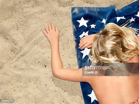 Girls Laying On The Beach Photos And Premium High Res Pictures Getty