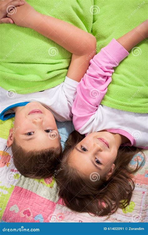 Brother And Sister Lying On The Bed Together Stock Image Image Of Portrait Happy 61402091