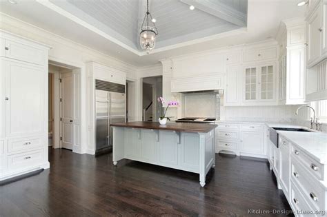 Though this kitchen's range and cabinets are both white, one has brass. Pictures of Kitchens - Traditional - White Kitchen ...