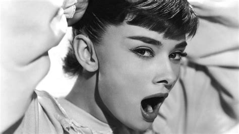 Download Yawning Beauty Audrey Hepburn Wallpaper
