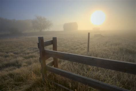 Foggy Autumn Sunrise Over Abandoned Farm With Fence And Barn Alberta