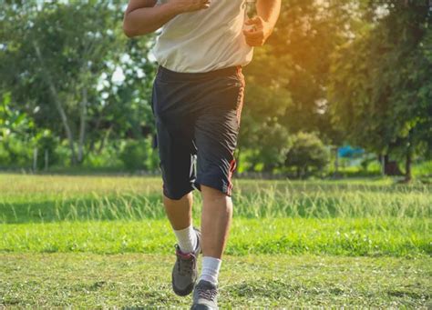 Man Running In Grass Field For Exercise Healthy Lifestyle Handsome