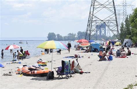 Hot Hot Steamy Weather Sees Thousands Flock To Burlington Beach For