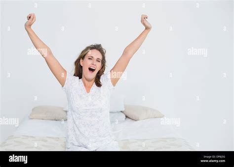 Pretty Woman In Bed Stretching When Waking Up Stock Photo Alamy