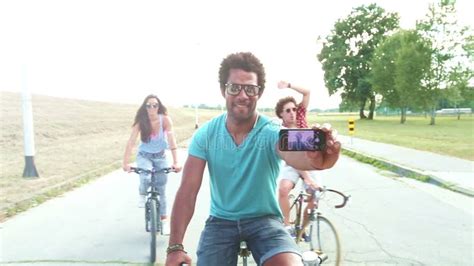 Three Young Adults On Bikes Taking Selfies With Phone Graded Stock Footage Video Of Athletic