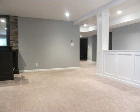 It is often thought that you should paint dark rooms, like basements, light colors; Finished basement idea. Half wall and light gray paint ...