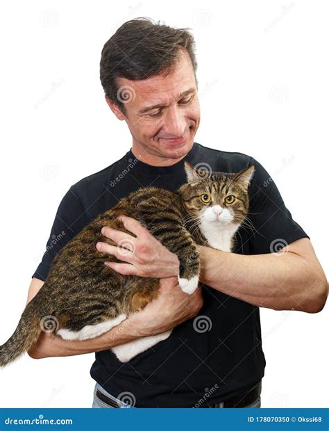 Mature Man Holds A Grey Cat In His Arms Stock Photo Image Of Brown