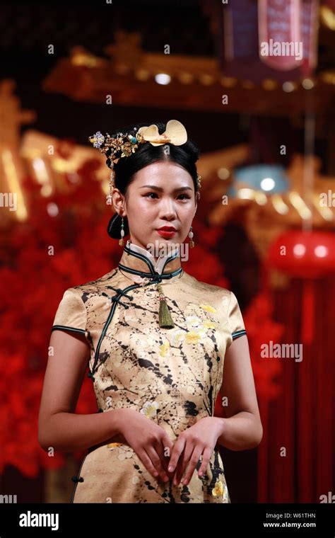 a model displays a traditional chinese wedding dress at the story of yanxi palace themed