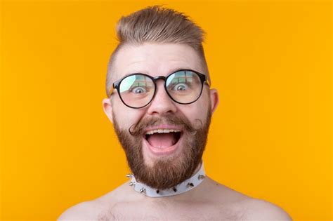 Premium Photo Stylish Young Hipster Man With A Mustache And Beard Joyfully Opens His Mouth On