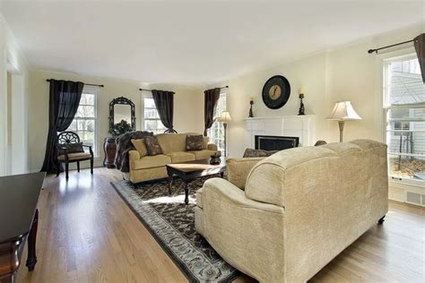 The blonde colored hardwood flooring in this traditional living room