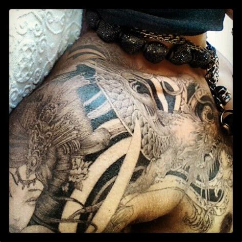 A pengiun tattoo on louis' rear end, inked in chicago. Larry's tattoos (Les Twins)....love tats, not to mention ...