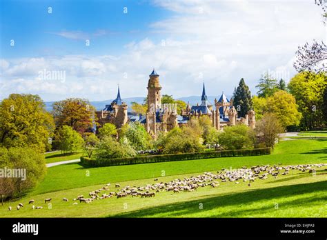 Lion Castle Lowenburg In Germany And Herd Of Sheep Stock Photo Alamy