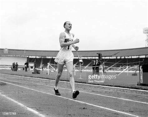 Ken Matthews Of Great Britian Competing During An Athletics Meeting