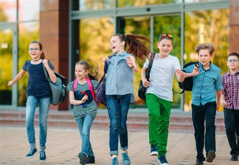 Group Of Kids Going To School Together Stock Photo Image Of Holding