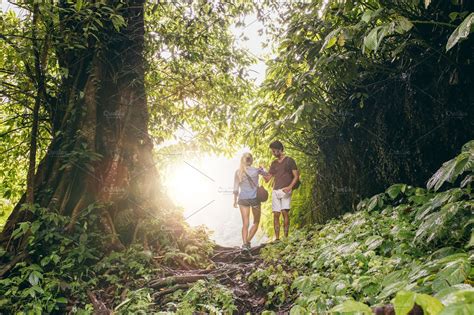 Couple Hiking In Tropical Jungle High Quality People Images ~ Creative Market
