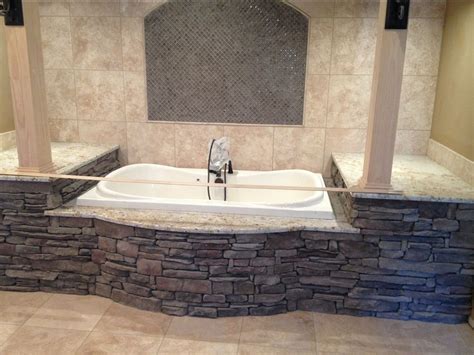 There's all sorts of people who have made tubs out of cedar and custom tubs are made from concrete and tile everyday. Stone Interiors - Tub Surround - South Alabama Brick Company