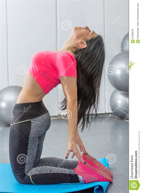 Brunette Stretching On A Mat Stock Image Image Of Healthy Lifestyle