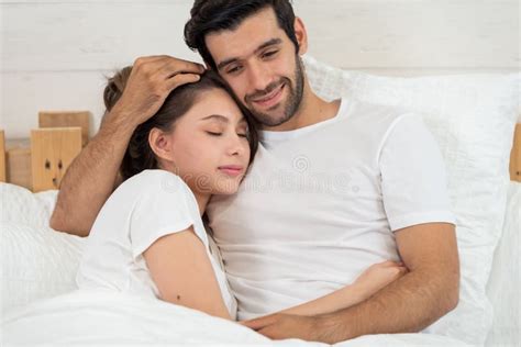Loving Couple Relaxing And Hugging In Bed Love And Relationships