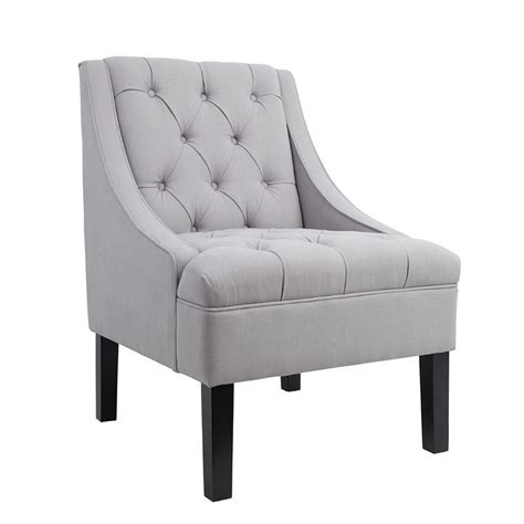 Create an inviting atmosphere with new living room chairs. Small Space Tufted Dove Accent Arm Chair by Accentrics Home | FurniturePick