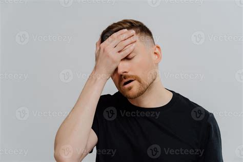 Worried Man Doing Facepalm Gesture And Keeping Eyes Closed Concerning