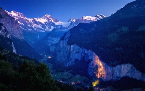 Landscape Of Switzerland Mountains Under Starry Blue Sky During