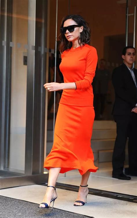 Victoria Beckham Is Glowing In Bright Orange Dress Following New York Fashion Week Show Success