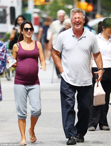 Alec Baldwin Carries Heavily Pregnant Wife Hilarias Handbag During New York Stroll Daily Mail