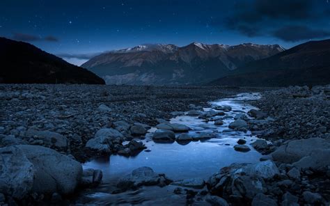 Night Sky Stars Mountain Landscape Stone River Wallpaper